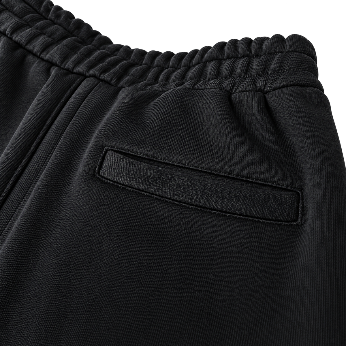 Signature Sweatpants Product V4 Black. Detailaufnahme der Gesäßtasche der schwarzen Maison De La Rue Sweatpants.