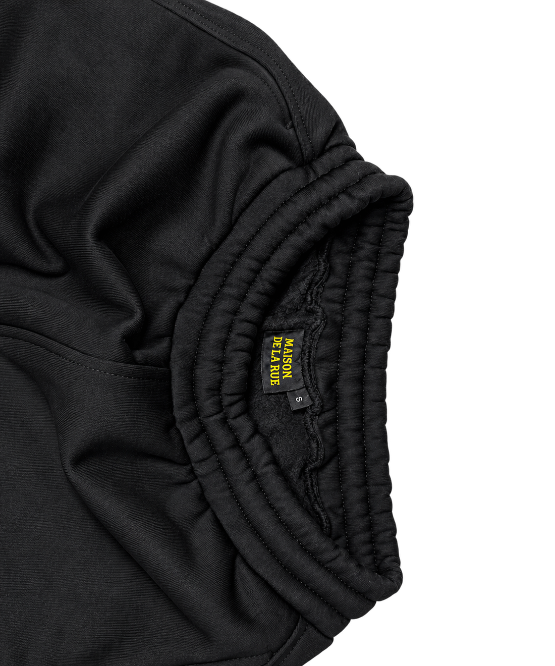 Signature Sweatpants Product V5 Black. Nahaufnahme des elastischen Bundes der schwarzen Maison De La Rue Sweatpants.