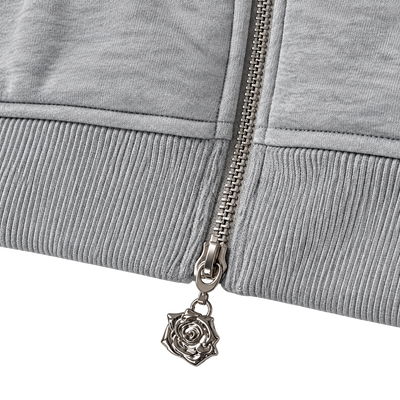 Signature Hoodie Product V6 Grey Melange. Nahaufnahme des grauen Maison De La Rue Hoodies mit Reißverschluss.